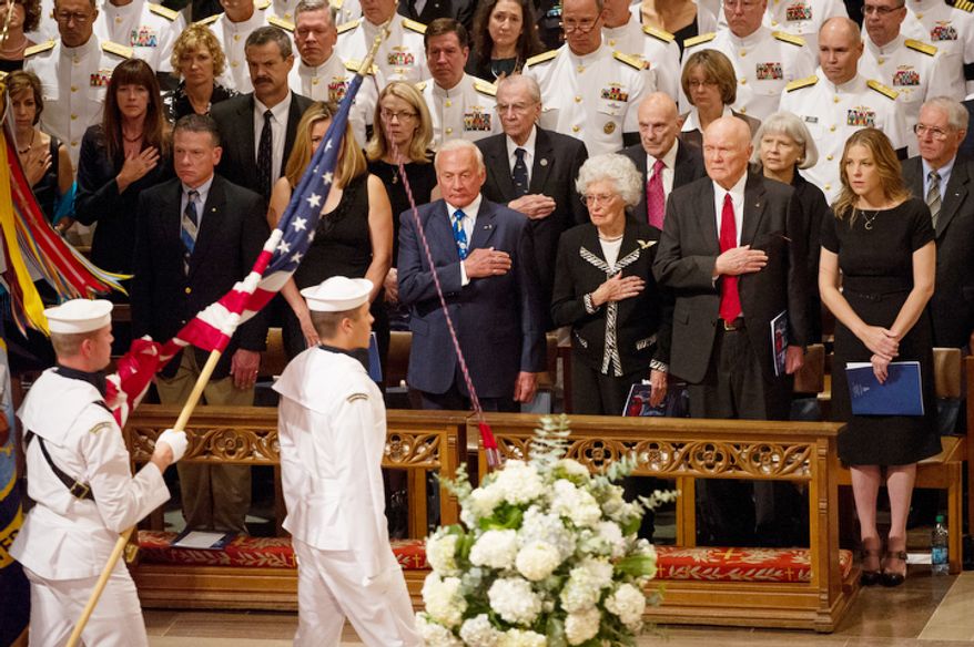 Astronaut Buzz Aldrin, fourth from right, Annie Glenn, third from right, her husband, astronaut and Sen. John Glenn (D-Ohio), second from right, and singer Diana Krall, right, watch as the flags are marched into the memorial service for Neil Armstrong at the National Cathedral, Washington, D.C., Thursday, September 13, 2012. (Andrew Harnik/The Washington Times)