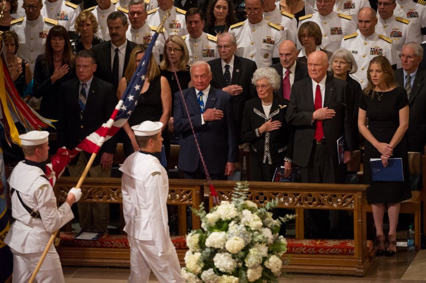 Astronaut Buzz Aldrin, fourth from right, Annie Glenn, third from right, her husband, astronaut and Sen. John Glenn (D-Ohio), second from right, and singer Diana Krall, right, watch as the flags are marched into the memorial service for Neil Armstrong at the National Cathedral, Washington, D.C., Thursday, September 13, 2012. (Andrew Harnik/The Washington Times)