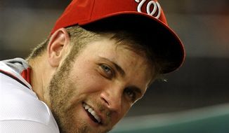 Washington Nationals&#39; Bryce Harper in the dugout during their baseball game against the Chicago Cubs at Nationals Park, Tuesday, Sept. 4, 2012, in Washington. (AP Photo/Richard Lipski)