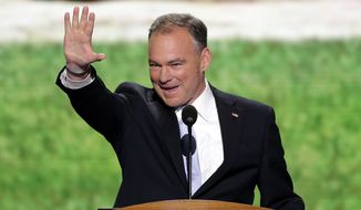 **FILE** Former Virginia Gov. Tim Kaine waves to the delegates from Virginia before addressing the Democratic National Convention in Charlotte, N.C., on Sept. 4, 2012. (Associated Press)