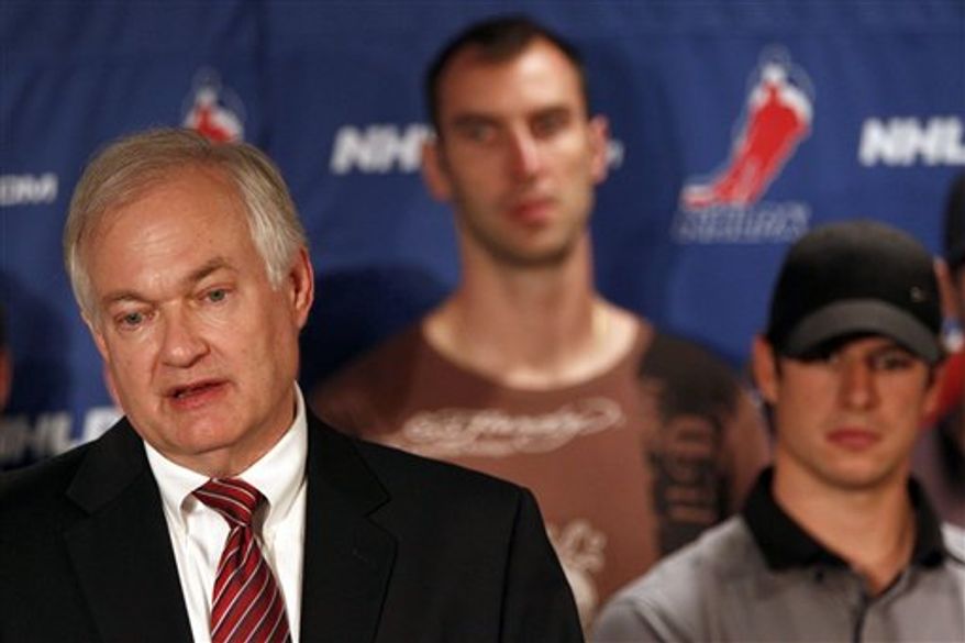 NHL Players Association executive director Donald Fehr, left, is joined by Boston Bruins' Zdeno Chara, center, and Pittsburgh Penguins' Sidney Crosby as he speaks to reporters during a news conference in New York, Thursday, Sept. 13, 2012. Fehr says a lockout can be avoided and that's up to the league. (AP Photo/Mary Altaffer)