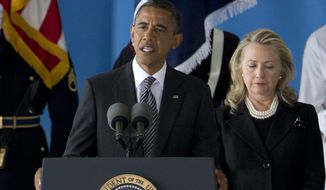 President Obama, accompanied by Secretary of State Hillary Rodham Clinton, speaks Sept. 14, 2012, during a ceremony at Andrews Air Force Base, Md., marking the return to the United States of the remains of the four Americans killed earlier in the week in Benghazi, Libya. (Associated Press) **FILE**