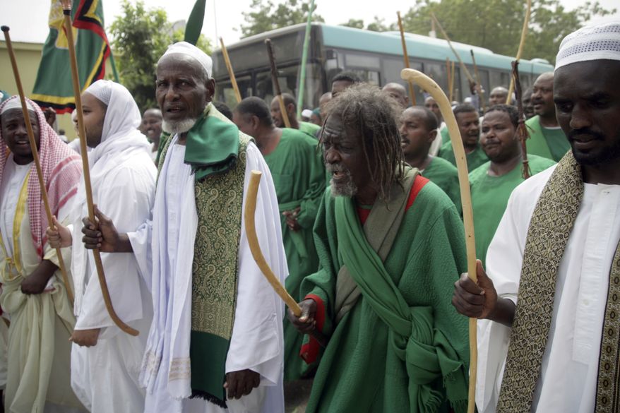Sudanese protesters march in Khartoum, Sudan, Friday, Sept. 14, 2012, against a film ridiculing Islam's Prophet Muhammad. Germany's Foreign Minister says the country's embassy in the Sudanese capital of Khartoum has been stormed by protesters and set partially on fire. Minister Guido Westerwelle told reporters that the demonstrators are apparently protesting against an anti-Islam film produced in the United States that denigrates the Prophet Muhammad.(AP Photo/Abd Raouf)