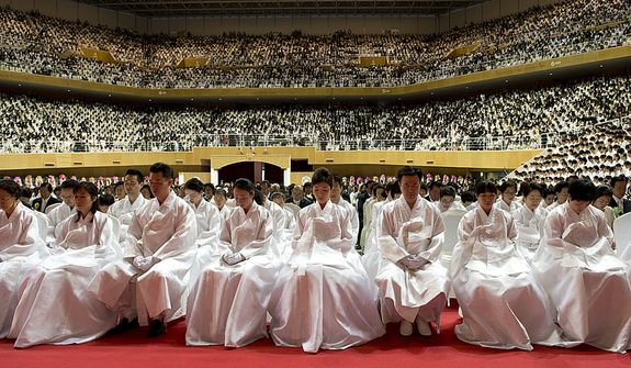 Family members of the late Rev. Sun Myung Moon sit up front in traditional Korean garb at the Seonghwa, or ascension, ceremony honoring their father at the Cheong Shim Peace World Center in Gapyeong, Korea on Saturday, Sept. 15, 2012. (Barbara L. Salisbury/The Washington Times)