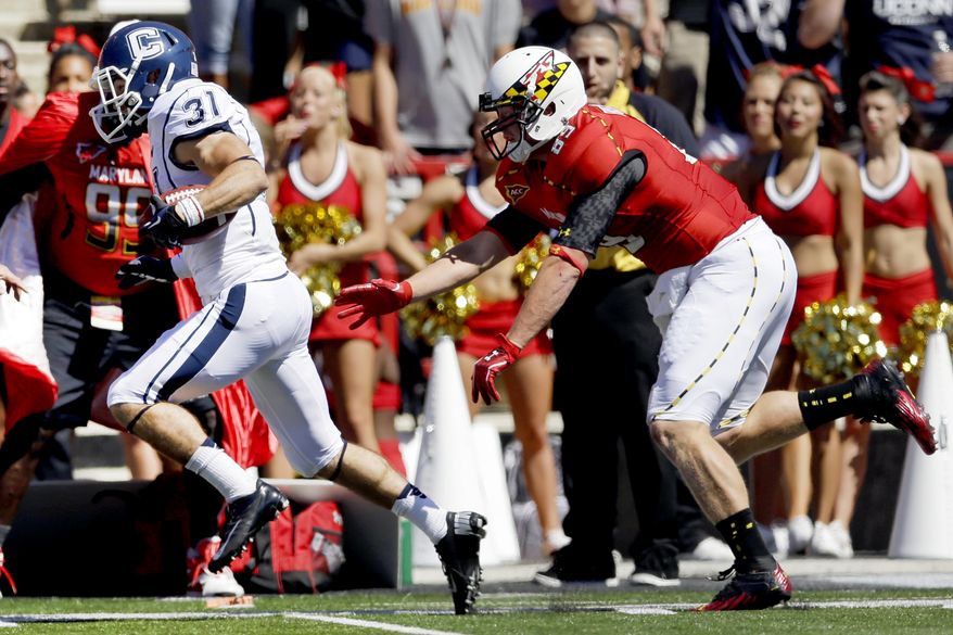 Connecticut wide receiver Nick Williams, left, outruns Maryland's Matt Furstenburg for a touchdown on a punt return in the first half of an NCAA college football game in College Park, Md., Saturday, Sept. 15, 2012. (AP Photo/Patrick Semansky)