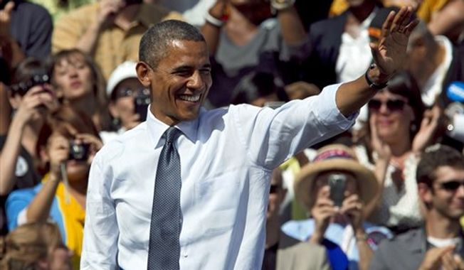 In this Sept. 13, 2012, photo, President Obama waves after speaking at a campaign rally in Golden, Colo. Obama and Republican Mitt Romney are embarking on a week heavy with travel through battleground states and appeals key constituencies, with both campaigns wrangling over unrest in the Middle East and who is best equipped to rejuvenate the economy. (AP Photo/Ed Andrieski)