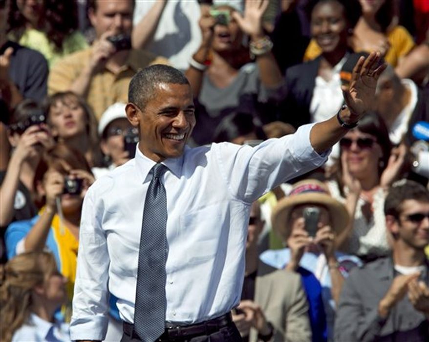In this Sept. 13, 2012, photo, President Obama waves after speaking at a campaign rally in Golden, Colo. Obama and Republican Mitt Romney are embarking on a week heavy with travel through battleground states and appeals key constituencies, with both campaigns wrangling over unrest in the Middle East and who is best equipped to rejuvenate the economy. (AP Photo/Ed Andrieski)