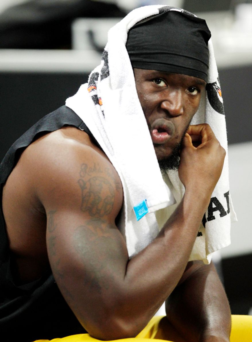 Washington Redskins outside linebacker Brian Orakpo sits on the bench in the final seconds of an NFL football game against the St. Louis Rams, Sunday, Sept. 16, 2012, in St. Louis. The Rams won 31-28. (AP Photo/Tom Gannam)