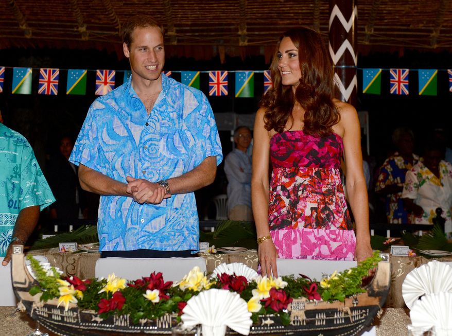 Britain's Prince William and his wife, Kate, prepare to sit for a meal at Government House in Honiara, Solomon Islands, on Sunday, Sept. 16, 2012. The royal couple is on a nine-day tour of the Far East and South Pacific in celebration of Queen Elizabeth II's diamond jubilee. (AP Photo/William West, Pool)