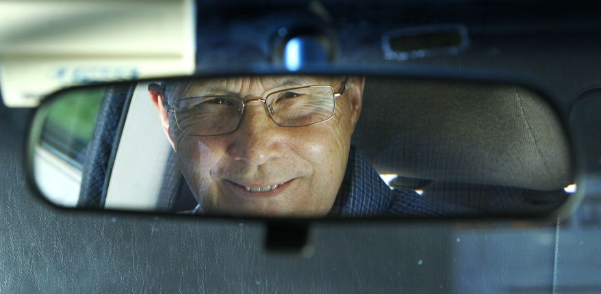 Jerry Wiseman is reflected in the rearview mirror of his vehicle in Schaumburg, Ill., on Sept. 12, 2012. Wiseman and his wife, Sandy, took refresher driving classes to help them stay safe behind the wheel for many more years. (Associated Press)