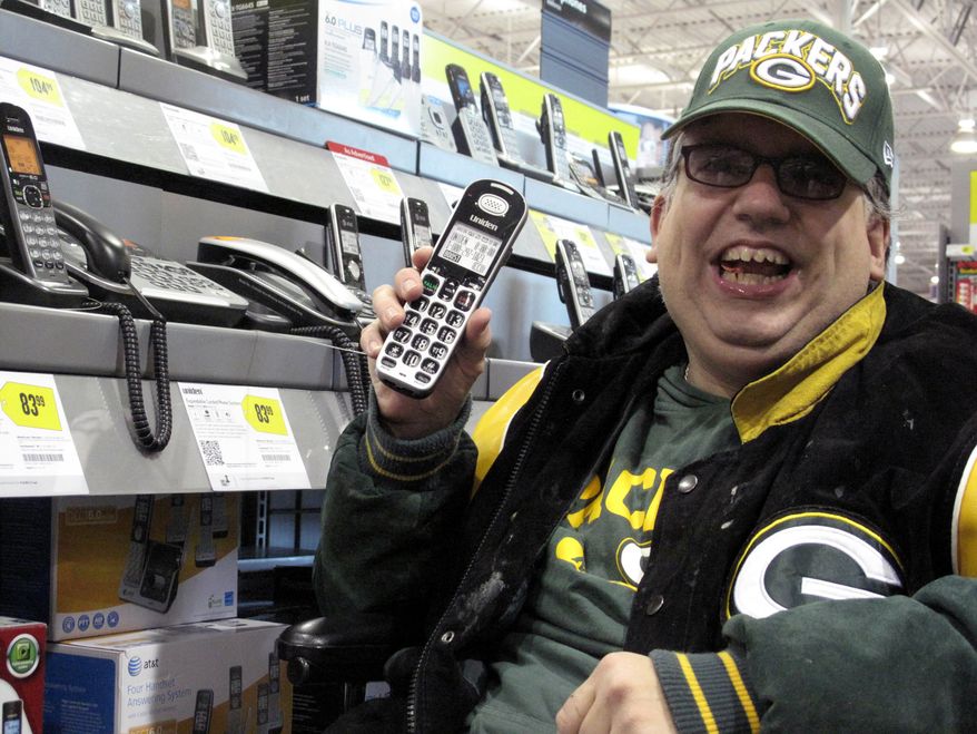 Sean Irvin looks for a telephone at a Best Buy on Monday, Sept. 17, 2012, in Anchorage, Alaska. A land-line phone is one of the things on which Mr. Irvin plans to spend his yearly Alaska Permanent Fund dividend. (AP Photo/Rachel D'Oro)