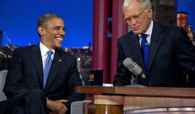 President Obama talks with David Letterman on the set of the &quot;Late Show With David Letterman&quot; at the Ed Sullivan Theater, Tuesday, Sept. 18, 2012, in New York. (AP Photo/Carolyn Kaster)
