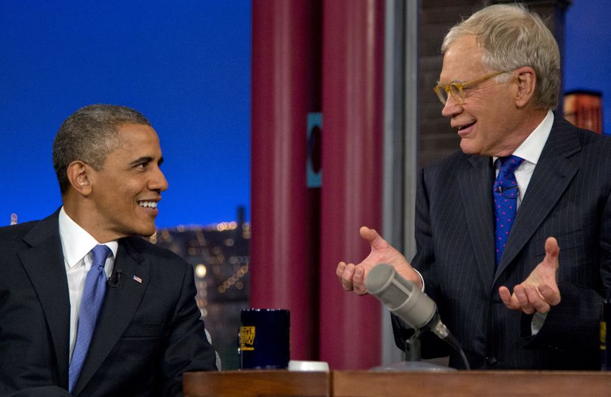 President Obama talks with host David Letterman on the set of "Late Show With David Letterman" at the Ed Sullivan Theater in New York on Tuesday, Sept. 18, 2012. (AP Photo/Carolyn Kaster)
