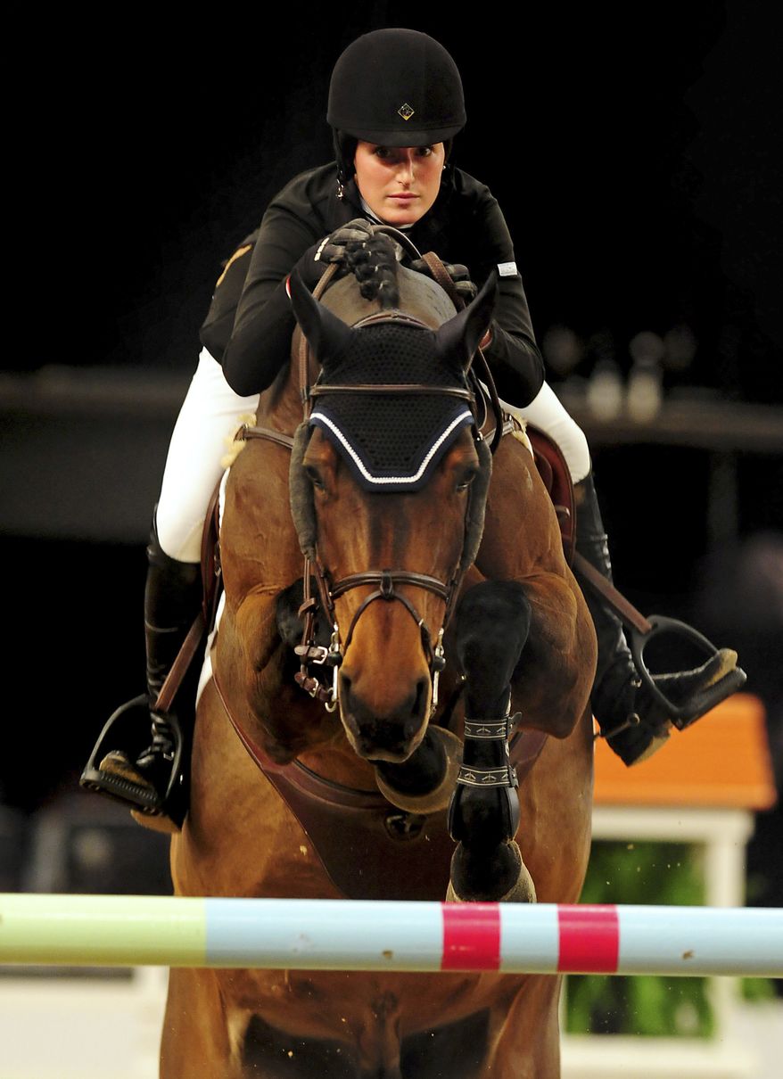 **FILE** Jessica Springsteen, an American international showjumper and daughter of rock star Bruce Springsteen, rides Oct. 6, 2011, in Birmingham, England. Olympic gold medalist Peter Charles' London 2012 horse Murka's Vindicat W has been sold to Springsteen, who will now ride the 10-year-old gelding that secured team gold for Great Britain at the 2012 London Olympics. (Associated Press/Rui Vieira)