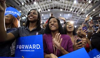North Carolina Central University student Aaliyah McMillan (center) cheers for first lady Michelle Obama as she speaks at the Durham, N.C., school on Sept. 19, 2012. (Associated Press/The News &amp; Observer, Takaaki Iwabu) 