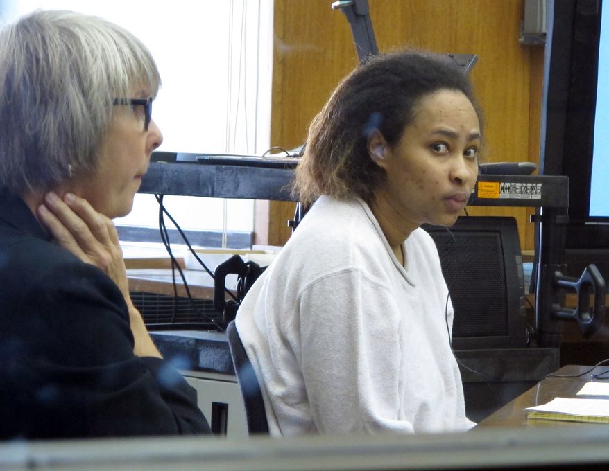 Annette Morales-Rodriguez (right) appears in a Milwaukee courtroom on Tuesday, Sept. 18, 2012, to face charges that she killed a pregnant woman and tried to steal her full-term fetus. Morales-Rodriguez's defense attorney, Debra Patterson (left), told jurors the homicides weren't intentional and her client never meant for the mother or baby to die. (AP Photo/Dinesh Ramde)