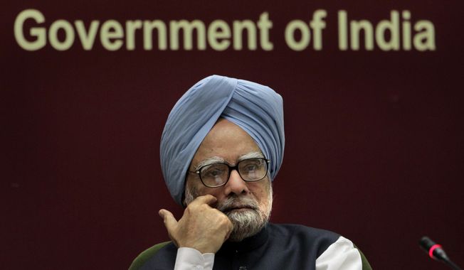 ** FILE ** Indian Prime Minister Manmohan Singh listens to a speaker during a conference in New Delhi on Nov. 23, 2010. (Associated Press)