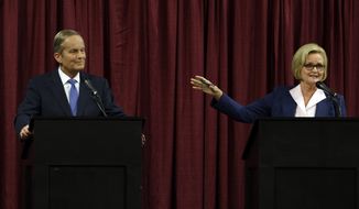 Democratic Sen. Claire McCaskill (right) speaks Sept. 21, 2012, as she looks toward Republican challenger Rep. Todd Akin during the first debate in the Missouri Senate race in Columbia, Mo. (Associated Press)