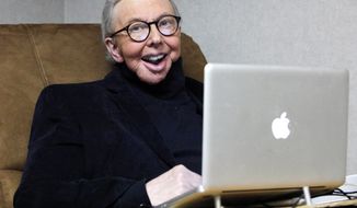 Pulitzer Prize-winning movie critic Roger Ebert works in his office at the WTTW-TV studios in Chicago in January 2011. (Associated Press)