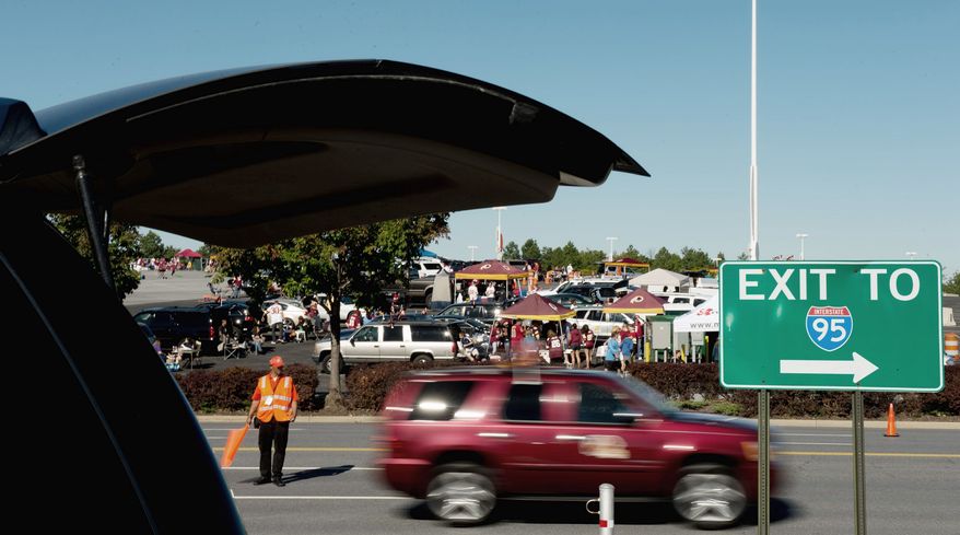Fans arrive at FedEx Field in Landover to catch the kickoff in the game Sunday between the Washington Redskins and the Cincinnati Bengals. Traffic and parking are the perennial subjects of complaints of fans. (Andrew Harnik/The Washington Times)