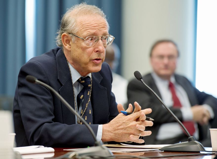 Dick Heller, the Washington, D.C. resident who won a 2008 Supreme Court case acknowledging his Second Amendment right to own a gun, testifies at a public hearing Monday, Sept. 24, 2012 at the Wilson Building in Washington, D.C. on Bill 19-888, the Administrative Disposition of Weapons Amendment Act of 2012. (Barbara L. Salisbury/The Washington Times)