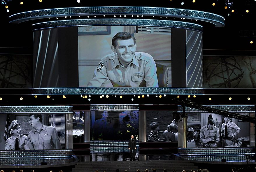 Ron Howard presents an "In Memorial" at the 64th Primetime Emmy Awards at the Nokia Theatre on Sunday, Sept. 23, 2012, in Los Angeles. Pictured onscreen is Andy Griffith. (John Shearer/Invision/AP)