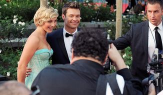 Actress Julianne Hough (left) and TV personality Ryan Seacrest arrive at the 64th Primetime Emmy Awards at the Nokia Theatre on Sunday, Sept. 23, 2012, in Los Angeles. (Jordan Strauss/Invision/AP)