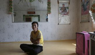 North Korean farmer O Yong-ae is interviewed at her home at the Migok Cooperative Farm in Sariwon, in North Korea&#39;s Hwanghae province, on Sunday, Sept. 23, 2012. (AP Photo/Vincent Yu)