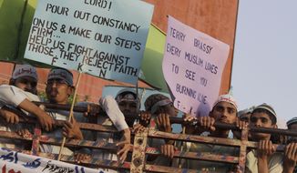 Supporters of a Pakistani religious group demonstrate against a film ridiculing Islam&#39;s Prophet Muhammad in Lahore, Pakistan, on Sunday, Sept. 23, 2012. (AP Photo/K.M. Chaudary)

