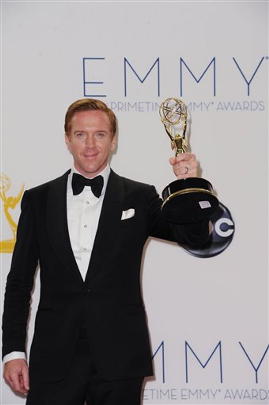 Damian Lewis poses for a photo at The 64th Annual Primetime Emmy Awards Winners Walk, Sunday, September 23, 2012, at LA Live, in Los Angeles. Lewis won the best actor award for his performance in Showtime's 'Homeland.' (Associated Press)