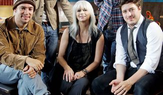 Emmylou Harris and Mumford &amp; Sons (from left) Ben Lovett, Winston Marshall, Ted Dwane and Marcus Mumford share their love of singing and the banjo Thursday on “CMT Crossroads.” (Associated Press)