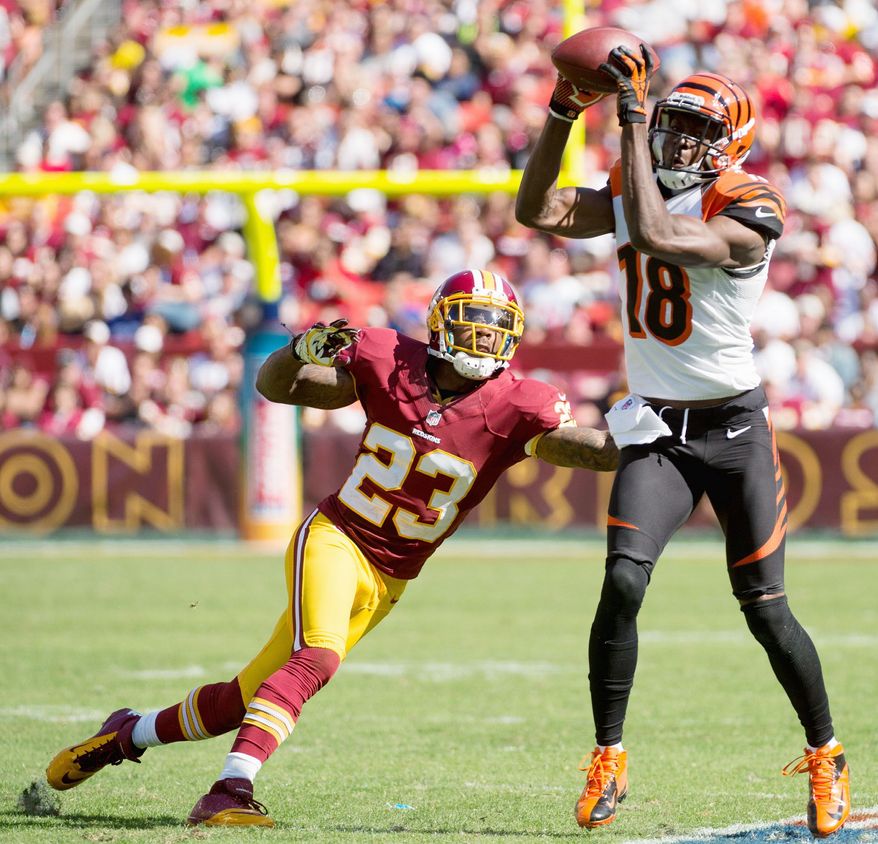 Redskins defensive backs seemed to be a step off Sunday as Cincinnati passed for 385 yards. Cornerback DeAngelo Hall arrived too late to prevent this completion to Bengals wide receiver A.J. Green. (Andrew Harnik/The Washington Times)