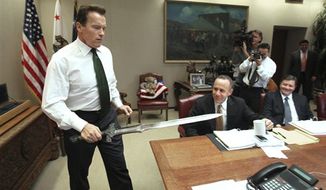 ** FILE ** In this Jan. 13, 2009, file photo, Gov. Arnold Schwarzenegger brings the sword he used in the movie &quot;Conan The Barbarian,&quot; to the conference table before the start of budget negotiations with legislative leaders at the Capitol in Sacramento, Calif. Schwarzenegger, who came to office during California&#39;s historic 2003 recall election, is releasing his autobiography, &quot;Total Recall: My Unbelievably True Life Story.&quot; (AP Photo/Rich Pedroncelli, file)