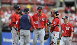 Washington Nationals pitcher Chien-Ming Wang (40) is pulled out of a baseball game by manager Davey Johnson during the fifth inning against the St. Louis Cardinals Sunday, Sept. 30, 2012, in St. Louis. (AP Photo/Bill Boyce)