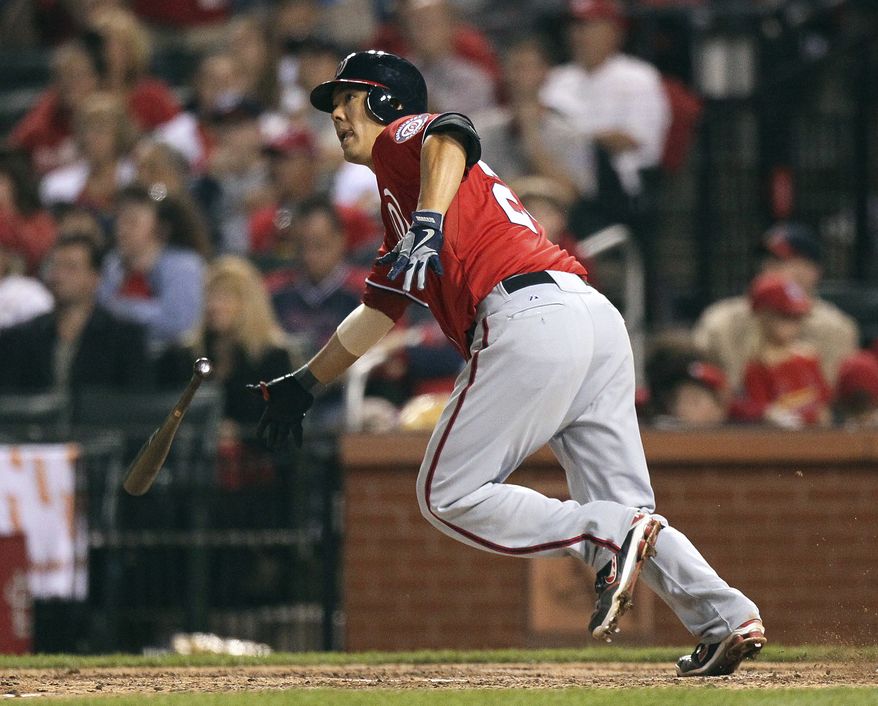 Nationals catcher Kurt Suzuki watches his game-winning double in the 10th inning Saturday night. (Associated Press)