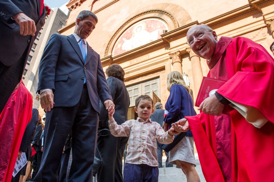 Rev. Msgr. W. Ronald Jameson, right, greets Virginia Attorney General Ken Cuccinelli, left and his son Max, 3, center, following Red Mass at Cathedral of St. Matthew the Apostle, Washington, D.C., Sunday, September 30, 2012. Red Mass, held annually in Washington, D.C. the day before the Supreme Court's new term opens is offered to invoke God's blessing and guidance on justices, judges, diplomats, attorneys and senior government officials. (Andrew Harnik/The Washington Times)
