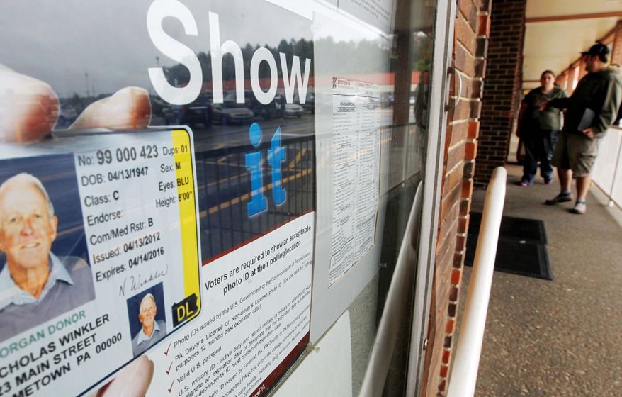 **FILE** With Pennsylvania’s voter-ID law still under scrutiny in state courts, a sign at a Pennsylvania driver’s license center in Butler alerts voters, who can get a qualifying state ID at the center. The voter-ID law, one of the toughest in the country, has become a lightning rod for Democrats who hate it and Republicans who support it. (Associated Press)