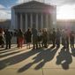 People wait in line to enter the Supreme Court on Oct. 1, 2012, before the justices return to the bench for another term. (Rod Lamkey Jr./The Washington Times)