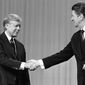 ** FILE ** In 1980: President Carter and Republican candidate Ronald Reagan shake hands after debating in Cleveland. (Associated Press)