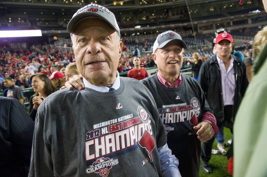 Nationals owners Ted and Mark Lerner take in the atmosphere after Washington clinched the National League East Division title at Nationals Park on Monday night. Ted Lerner became the managing principal owner of the franchise in May 2006. (Andrew Harnik/The Washington Times) ** FILE **