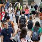 Students walk through the University of Texas at Austin campus. The campus has one of the most-diverse student bodies in the country. Texas has maintained some use of affirmative action. It also has implemented a &quot;top 10 percent&quot; plan granting automatic admission to top high school students based on class rank and, as a result, its enrollment of minorities has risen overall since the late 1990s. (Associated Press)