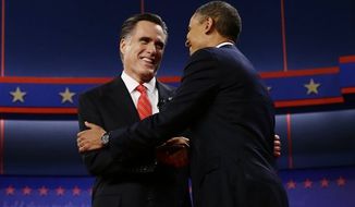 President Barack Obama and Republican presidential candidate and former Massachusetts Gov. Mitt Romney meet on stage at the start of the first presidential debate in Denver, Wednesday, Oct. 3, 2012. (AP Photo/Charles Dharapak)