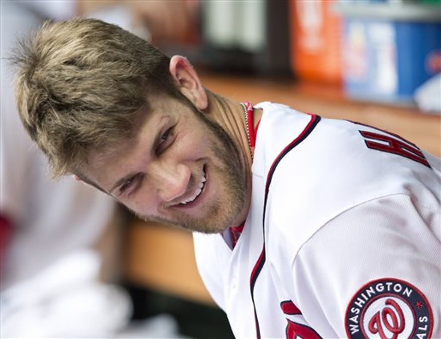 ** FILE ** Washington Nationals Bryce Harper smiles as he sits in the dugout during a baseball game (AP Photo/Manuel Balce Ceneta)