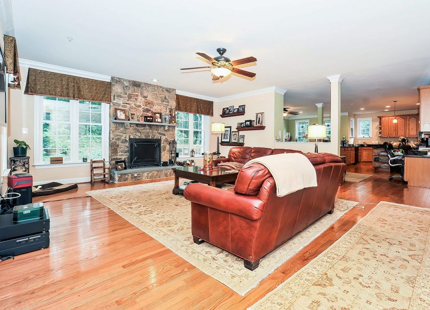 The oversized kitchen and family room are across the back of the home.