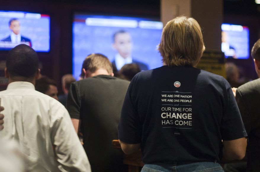 Democratic supporters watch the first presidential debate between President Obama and Republican Mitt Romney nominee during a watch party put on by the Arlington Young Democrats and the Arlington County Democratic Committee at Bailey's Pub in Ballston Common Mall, Ballston, Va., Wednesday, Oct. 3, 2012. (Craig Bisacre/The Washington Times)