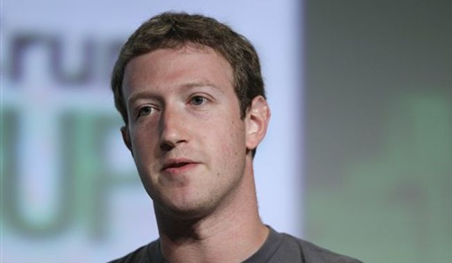 ** FILE ** Facebook CEO Mark Zuckerberg speaks during a &quot;fireside chat&quot; at a conference organized by technology blog TechCrunch in San Francisco on Tuesday, Sept. 11, 2012. (AP Photo/Eric Risberg)

