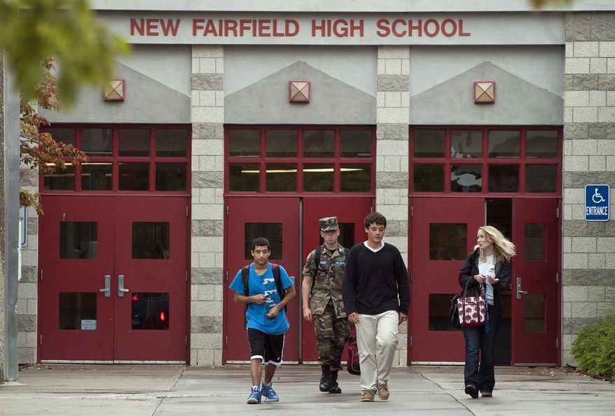 Students leave New Fairfield High School in New Fairfield, Conn., on Sept. 28, 2012. Tyler Giuliano, a student involved in Civil Air Patrol at the school, was killed by his father, Jeffrey Giuliano, during what appeared to be an attempted burglary early Thursday morning. Giuliano fatally shot a masked teenager in self-defense, then discovered that he had killed his son, state police said. (Associated Press)