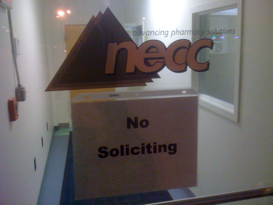 A sign on the door to the New England Compounding Center requests no soliciting at the Framingham, Mass., company on Oct. 3, 2012. An outbreak of a rare and deadly form of meningitis sickened 26 people in five states who received steroid injections mostly for back pain, health officials said. The Food and Drug Administration identified the New England company as the maker of the steroid. (Associated Press)