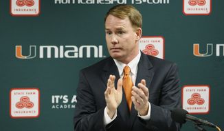 FILE - This April 19, 2011 file photo shows Miami athletic director Shawn Eichorst clapping as he speaks during a news conference in Coral Gables, Fla. A person with knowledge of the situation says that Eichorst has resigned, less than 18 months after he began leading the Hurricanes&#39; troubled department. The person spoke to The Associated Press Thursday, Oct. 4, 2012,  on condition of anonymity because the university had not publicly announced Eichorst&#39;s decision, and that university officials were deciding on how to proceed with an interim AD.  (AP Photo/Wilfredo Lee, File)