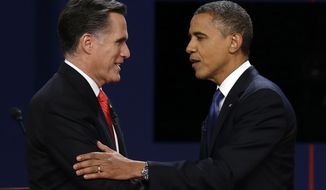 Republican presidential nominee Mitt Romney and President Obama shake hands on Wednesday, Oct. 3, 2012, after the first presidential debate at the University of Denver. (Associated Press)